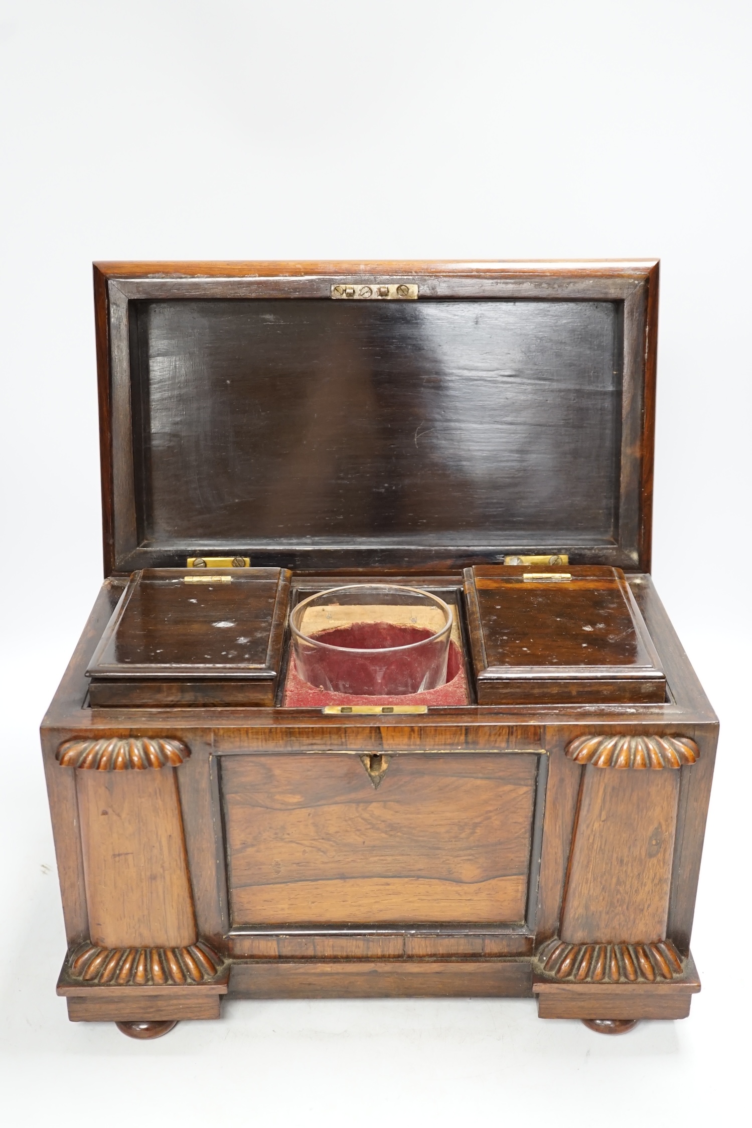 A large William IV rosewood sarcophagus tea caddy, 27cm high. Condition - escutcheon missing, fair